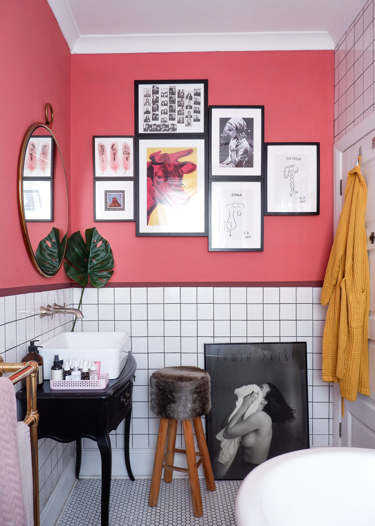 moroccan pink bathroom with white tiles and vintage dresser