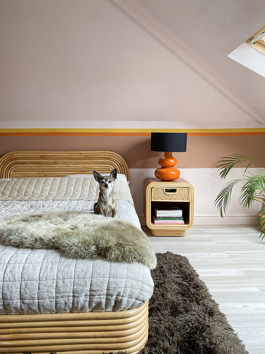 70s style rental-friendly pink bedroom with mural