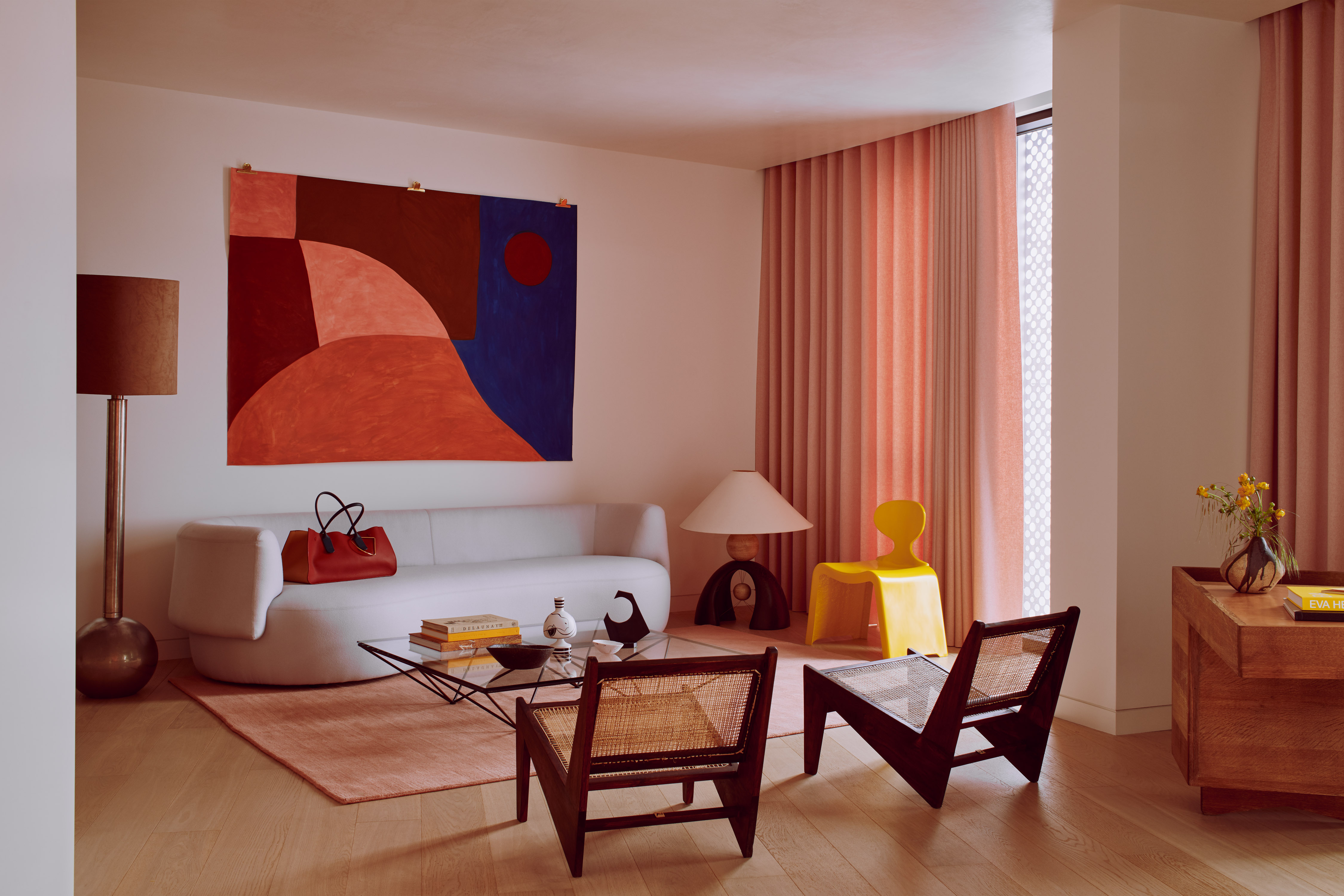 pink living room with abstract art