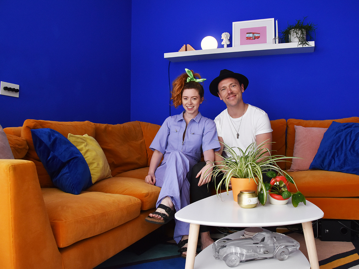 couple in yellow and blue living room